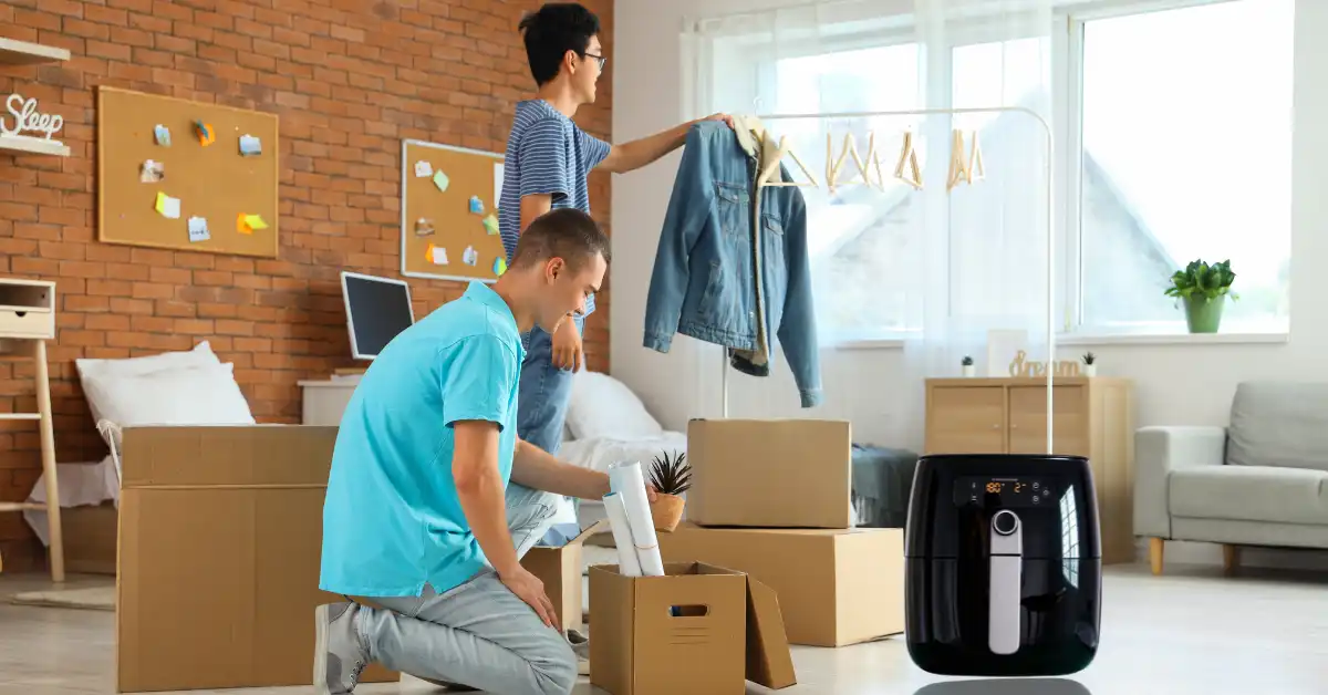 students with air fryer in dorm room